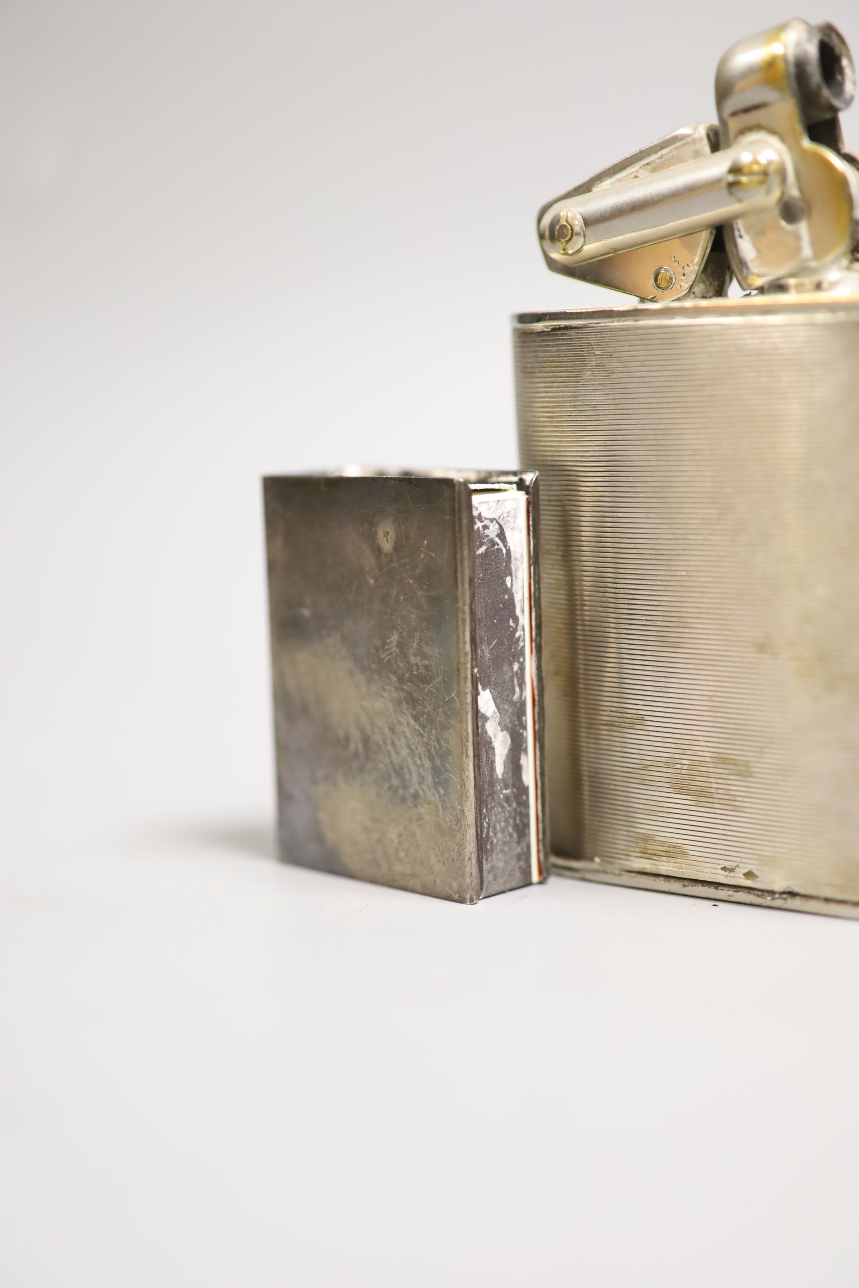 A K W plated table lighter, 10cm high and white metal match case holder
